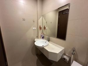 a white bathroom with a sink and a mirror at An Lạc 402MD in Hanoi +48 photos