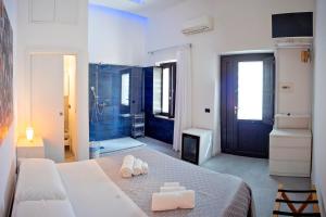 Postel nebo postele na pokoji v ubytování La Bella Trani - Suites and B&B