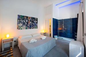 Postel nebo postele na pokoji v ubytování La Bella Trani - Suites and B&B