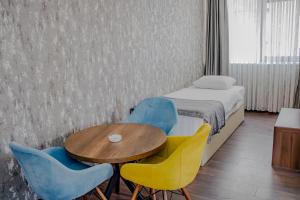 Postel nebo postele na pokoji v ubytování Ma City Hotel