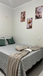 Ένα ή περισσότερα κρεβάτια σε δωμάτιο στο Aconchego Hospedagem