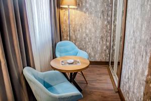 Posezení v ubytování Ma City Hotel