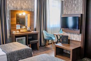 TV a/nebo společenská místnost v ubytování Ma City Hotel