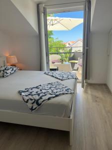 Postel nebo postele na pokoji v ubytování Apartments Duje