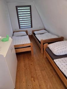 Postel nebo postele na pokoji v ubytování Chata U Sluníčka