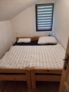 Postel nebo postele na pokoji v ubytování Chata U Sluníčka