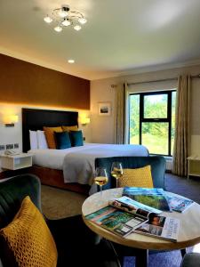 Voodi või voodid majutusasutuse Mill Park Hotel toas