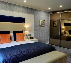 Voodi või voodid majutusasutuse Mill Park Hotel toas