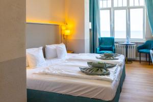 Postel nebo postele na pokoji v ubytování Hotel Germania