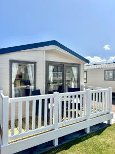 a house with a white fence at North Bay Leisure Park in Bridlington +15 photos