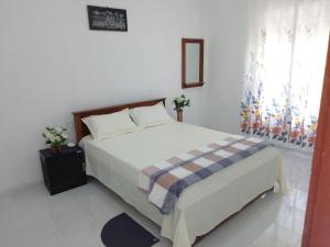 Postel nebo postele na pokoji v ubytování Tropical Suites - Airport Transit Residence