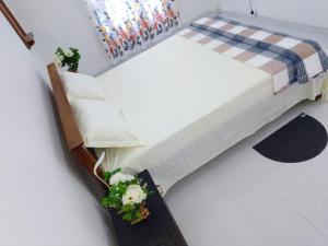 Postel nebo postele na pokoji v ubytování Tropical Suites - Airport Transit Residence