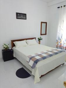 Postel nebo postele na pokoji v ubytování Tropical Suites - Airport Transit Residence