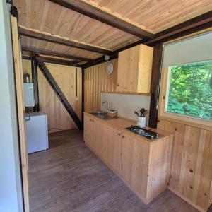 a kitchen with a sink and a counter top at Glamping Fikfak in Bled