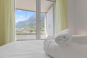 Giường trong phòng chung tại Détente Thermale à Saillon proche des bains, 4 personnes