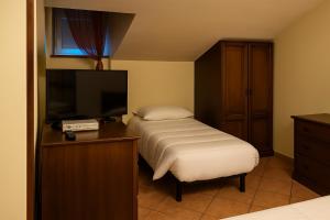 Letto o letti in una camera di Albergo Reale