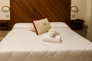 Letto o letti in una camera di Albergo Reale