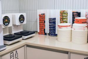 a kitchen with stacks of plates on a counter at Blue Note in Incheon