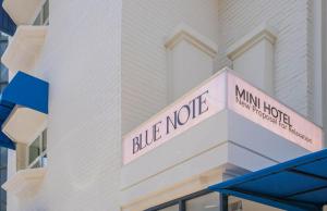 a sign on the side of a building at Blue Note in Incheon