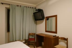 Letto o letti in una camera di Albergo Reale