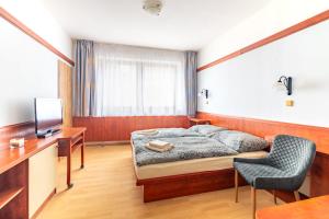 TV a/nebo společenská místnost v ubytování Hotel Macocha