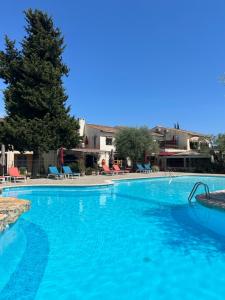 a large swimming pool with blue water at La Lune De Mougins - Hotel & Spa in Mougins