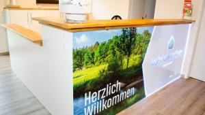 a sign on a counter that reads hospitalification mobilization at Ferienpark Grafschaft Bentheim in Uelsen