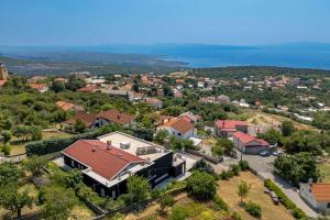an aerial view of a house in a town at Wellness Villa Biocrystal in Bakarac +44 photos