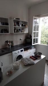 a kitchen with a stove and a dishwasher on a counter at Appart typique dans un chateau in Ajaccio