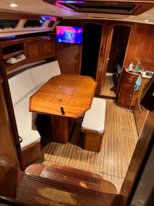 a wooden table in the back of a boat at Sailboat on the sea in Medulin