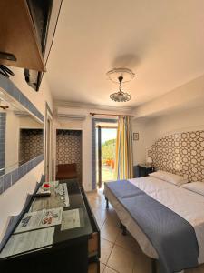 Postel nebo postele na pokoji v ubytování Hotel 4 Stagioni