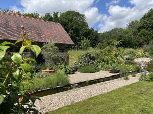 a garden in front of a house at Beauvoir Court Stables in Dorchester