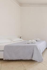 A bed or beds in a room at Anema e Core