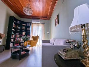 a living room with a couch and a table at Sirius in Igoumenitsa