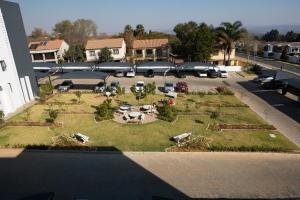 an aerial view of a garden in a parking lot at Oasis Comfort Apartment in Midrand