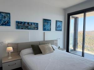 Ένα ή περισσότερα κρεβάτια σε δωμάτιο στο Agi Canyelles Mar +29 φωτογραφίες