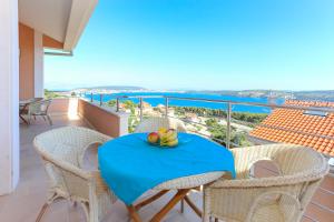 a table with a banana on it on a balcony at Villa Luciana in Trogir