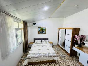 a bedroom with two beds in a room at Mansard 91 in Sergeli Bekati