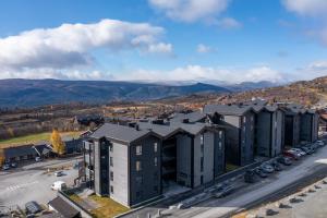 an aerial view of a building in a city at Riddertunet deluxe in Beitostøl