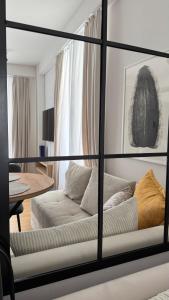 a living room with a couch and a table at Kaneo Central Apartments in Ohrid