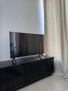 TV a/nebo společenská místnost v ubytování Mezzanine