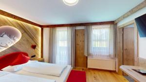 Postel nebo postele na pokoji v ubytování Hotel - Restaurant - Sonnblick