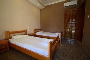 Postel nebo postele na pokoji v ubytování Menis Haus Rooms