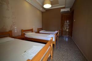 Postel nebo postele na pokoji v ubytování Menis Haus Rooms