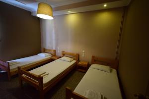 Postel nebo postele na pokoji v ubytování Menis Haus Rooms