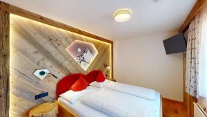 Postel nebo postele na pokoji v ubytování Hotel - Restaurant - Sonnblick