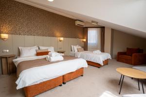 Postel nebo postele na pokoji v ubytování Saffron Boutique Hotel