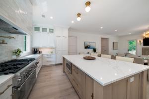 a kitchen with white countertops and a large island at 2680 Gnarled Pine in Seabrook Island