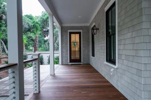 a front porch of a home with a door and windows at 2680 Gnarled Pine in Seabrook Island