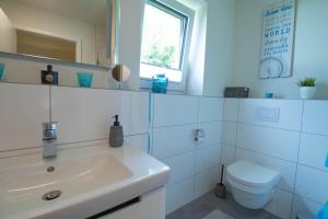 Koupelna v ubytování Ostseeidylle Ringhus Kellenhusen - nur wenige Meter vom Strand entfernt